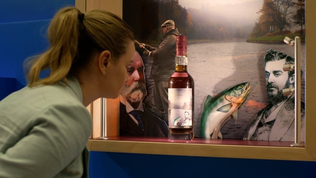 Patricia Byott, brand ambassador of The Macallan in Hong Kong and Macau, looks at a bottle of 54-year-old Giant and the Fish whisky at the Anecdotes of Ages experience in Hong Kong.