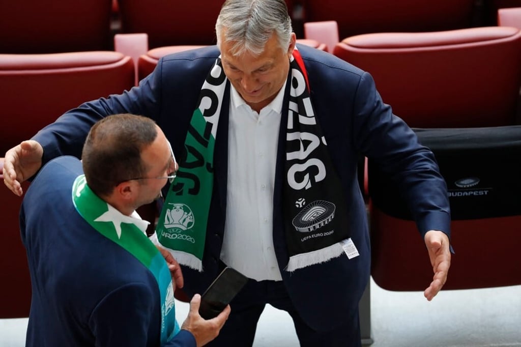 Hungarian Prime Minister Viktor Orban, right at Puskas Arena in Budapest on June 19. Photo: AFP