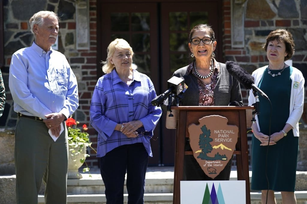 US Interior Secretary Deb Haaland, centre, speaks to reporters in Winter Harbour, Maine on Saturday. Photo: AP