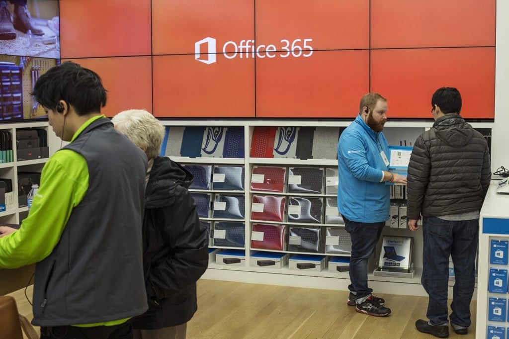 Employees assist customers at a Microsoft store in Bellevue, Washington, on January 26, 2017. Microsoft's cloud infrastructure and Office apps have helped lift the company to its record valuation. Photo: Bloomberg Employees assist customers at a Microsoft store in Bellevue, Washington, on January 26, 2017. Microsoft's cloud infrastructure and Office apps have helped lift the company to its record valuation. Photo: Bloomberg