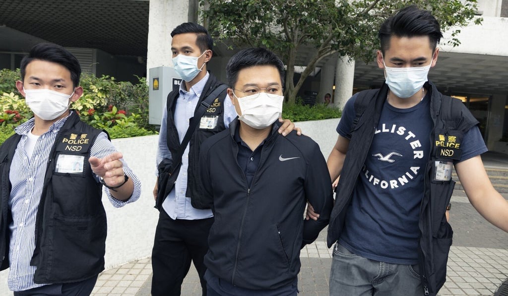 Apple Daily editor-in-chief Ryan Law is taken away by police last Thursday. Photo: Robert Ng