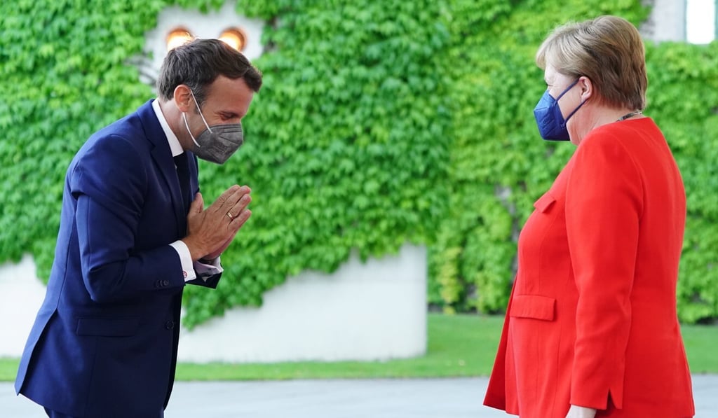 French President Emmanuel Macron and German Chancellor Angela Merkel want to engage with the Russian president. Photo: EPA