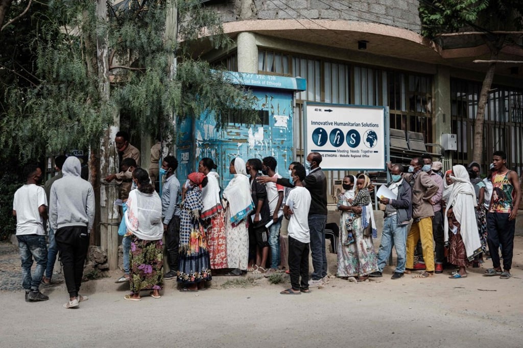 People queue to enter a bank in Mekele, the capital of Tigray region in Ethiopia, on Friday. Photo: AFP