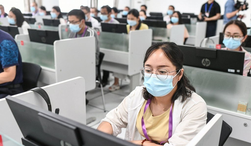 Teachers marking examination papers online for the National College Entrance Examination (NCEE), known as Gaokao. Photo: AFP