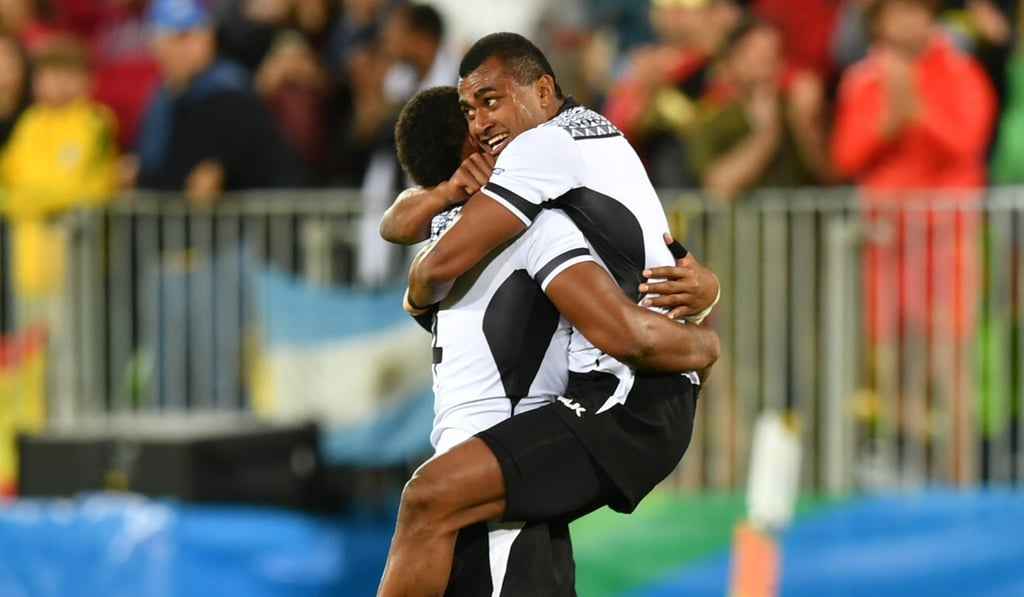 Fiji players celebrate winning the rugby sevens gold medal match between Fiji and Britain at the Rio 2016 Olympic Games at Deodoro Stadium in Rio de Janeiro in 2016. Photo: AFP