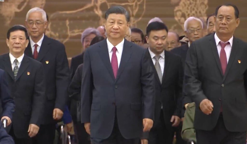 Some of the July 1 medal recipients with President Xi Jinping at the awards ceremony. Photo: CCTV
