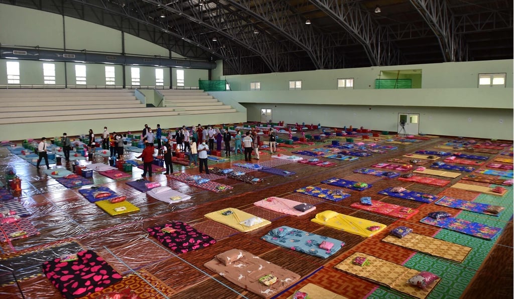 Officials inspect a university gymnasium converted into a field hospital for Covid-19 patients in Thailand's southern province of Narathiwat on June 25. photo: AFP Officials inspect a university gymnasium converted into a field hospital for Covid-19 patients in Thailand's southern province of Narathiwat on June 25. photo: AFP