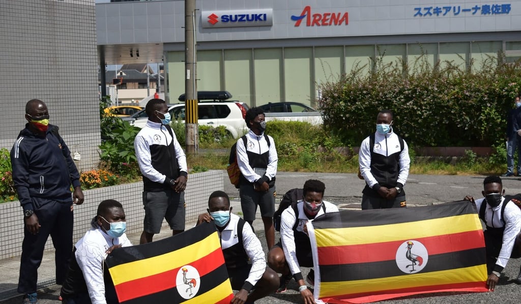 Members of the Uganda Olympics team pose for a photo at a hotel in Izumisano city. Photo: AFP