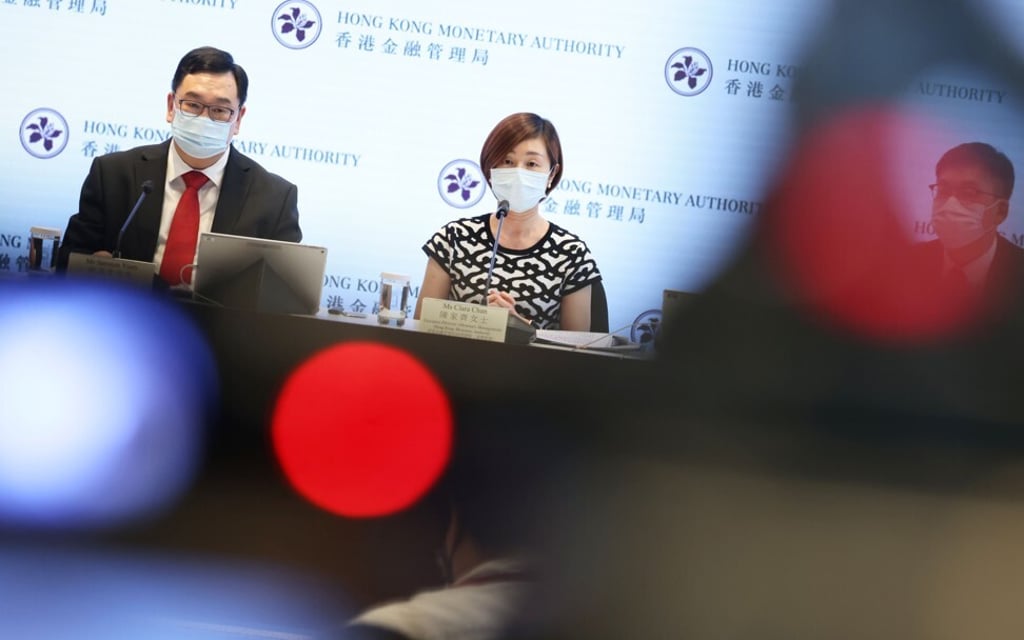 Samson Yuen, head of currency and settlement at the Hong Kong Monetary Authority and Clara Chan, executive director (monetary Management) speak at a briefing on Silver Bond in Central on June 29. Photo: K. Y. Cheng