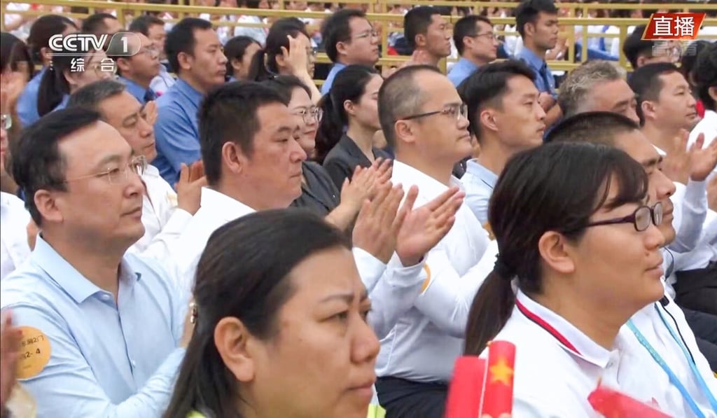 Meituan's founder and chief executive Wang Xing (centre right, wearing white shirt with glasses) was seen in the live broadcast of the Communist Party's centenary celebration in Tiananmen Square on Thursday. Photo: CCTV