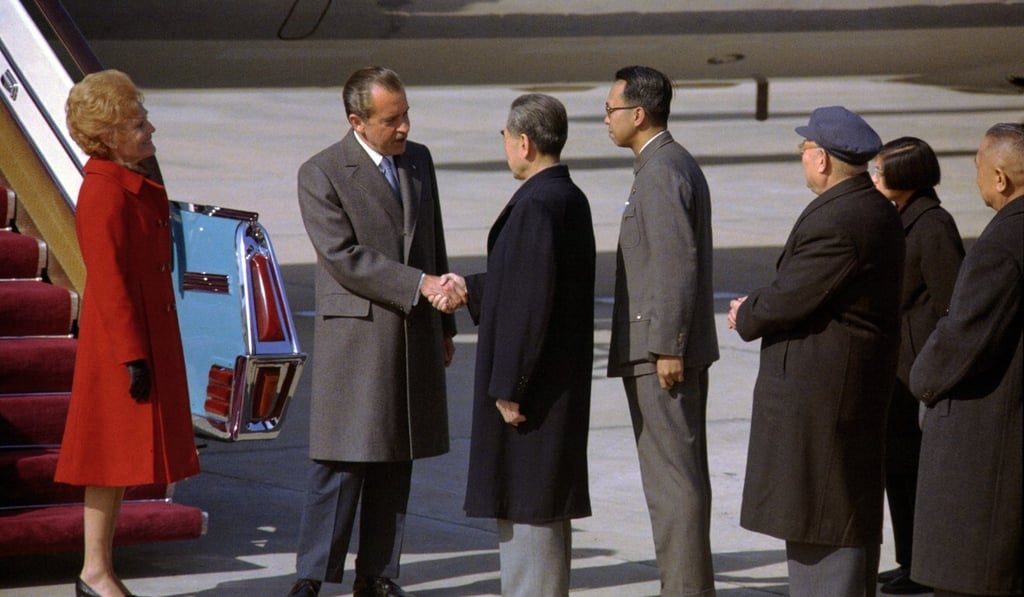 Richard Nixon and Zhou Enlai shake hands on the tarmac beside Air Force One on the American president’s arrival in Beijing on February 21, 1972. Photo: Getty Images