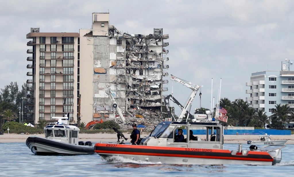 US coastguard and Miami-Dade Police patrol as US President Joe Biden visits the area of Surfside, Florida on Thursday. Photo: Reuters