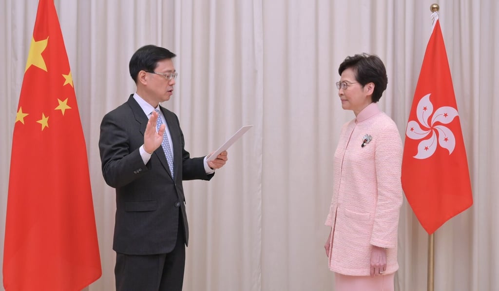 John Lee (left) is sworn in to his new position as Hong Kong’s No 2 official. Photo: Handout John Lee (left) is sworn in to his new position as Hong Kong’s No 2 official. Photo: Handout