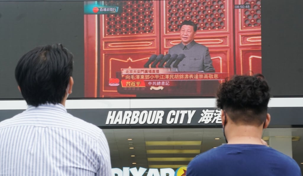 People watch President Xi Jinping’s speech on a large screen in Hong Kong’s Tsim Sha Tsui on Thursday. Photo: Felix Wong People watch President Xi Jinping’s speech on a large screen in Hong Kong’s Tsim Sha Tsui on Thursday. Photo: Felix Wong