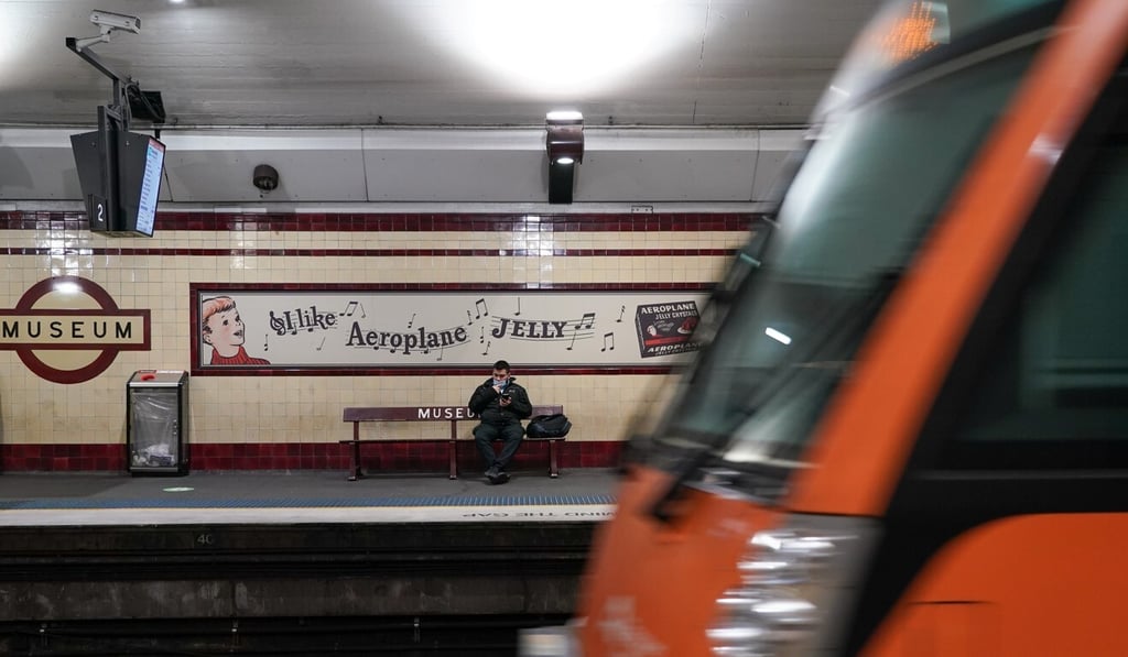 A lone passenger waits on a train platform in Sydney, which has been put in lockdown to curb the spread of Covid-19. Photo: Reuters