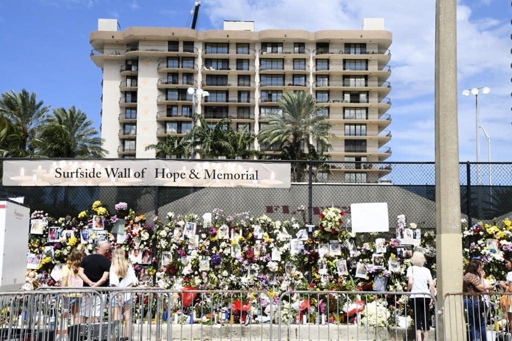 A memorial with photos of some of the missing from a partially collapsed block of flats in Surfside, Florida. Photo: Kyoto