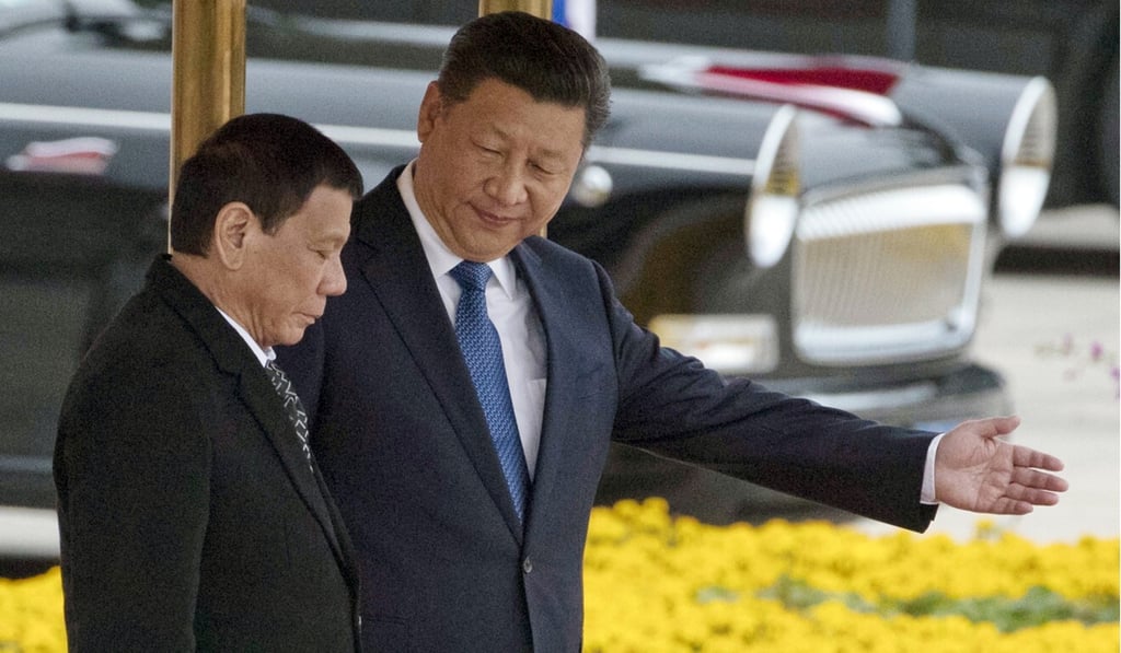 Chinese President Xi Jinping, right, shows Philippine President Rodrigo Duterte the way during a welcoming ceremony in Beijing in 2016. Photo: AP Chinese President Xi Jinping, right, shows Philippine President Rodrigo Duterte the way during a welcoming ceremony in Beijing in 2016. Photo: AP