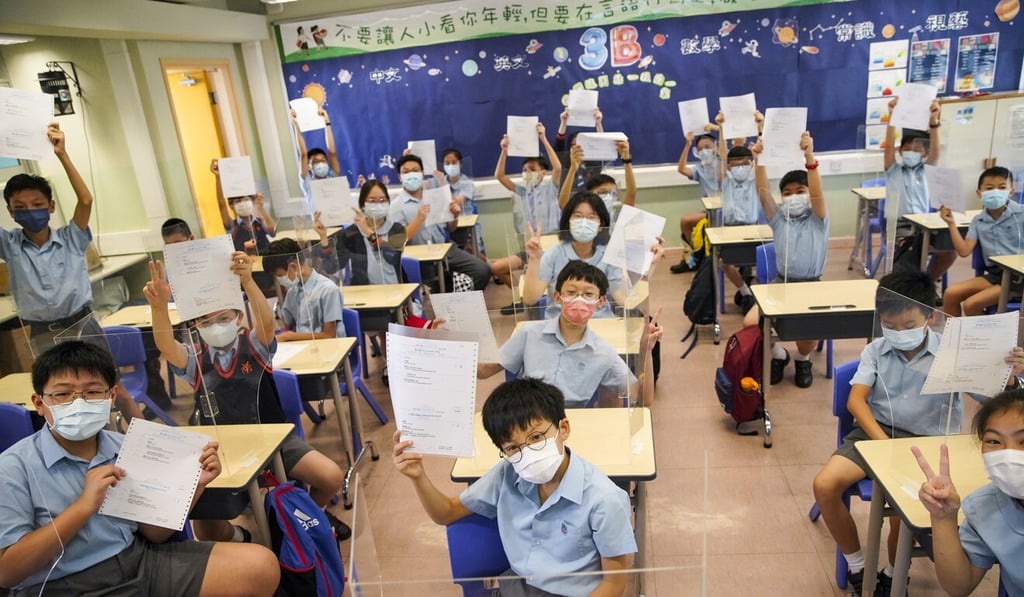 Students at Yaumati Catholic Primary School (Hoi Wang Road) show their Secondary One placement results. Photo: Winson Wong Students at Yaumati Catholic Primary School (Hoi Wang Road) show their Secondary One placement results. Photo: Winson Wong