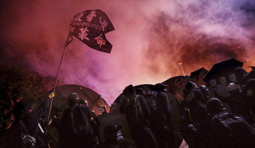 Tear gas swirls amid clashes between riot police and students at Chinese University’s Sha Tin campus on November 12, 2019. Photo: Sam Tsang Tear gas swirls amid clashes between riot police and students at Chinese University’s Sha Tin campus on November 12, 2019. Photo: Sam Tsang