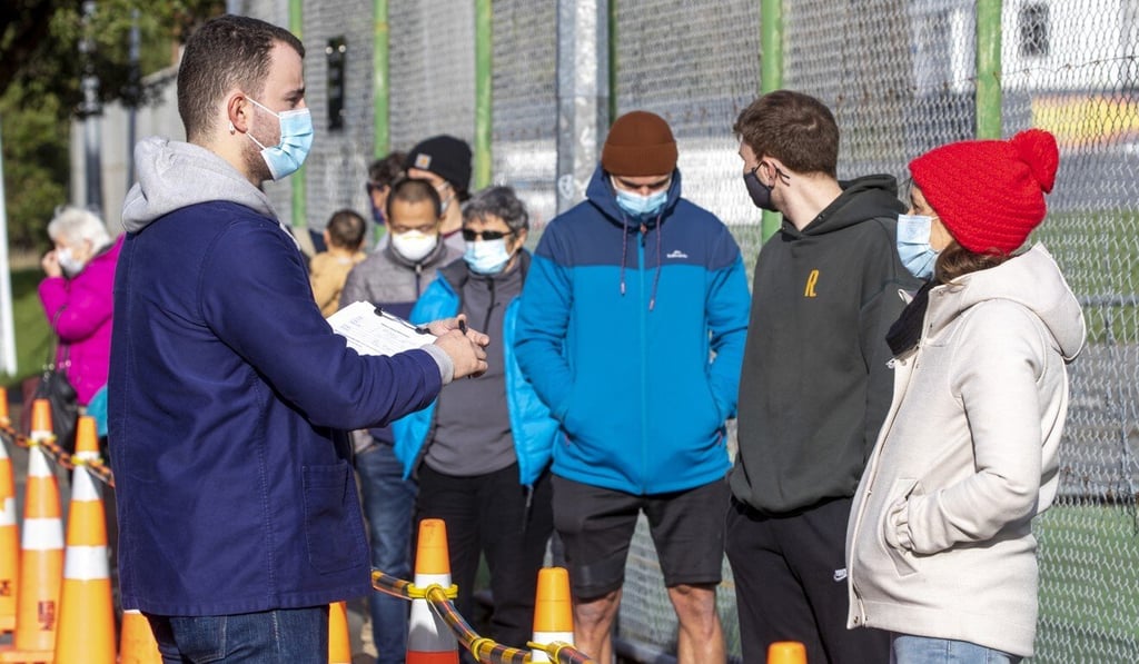 People queue outside a Covid-19 testing station in Wellington, New Zealand. Photo: AP People queue outside a Covid-19 testing station in Wellington, New Zealand. Photo: AP