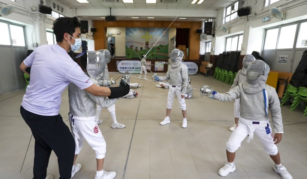 Hong Kong Fencing Association coach Tsoi Chung-ngan teaches a class of students at the Alliance Primary School in Shek Kip Mei in June. Photo: Jonathan Wong