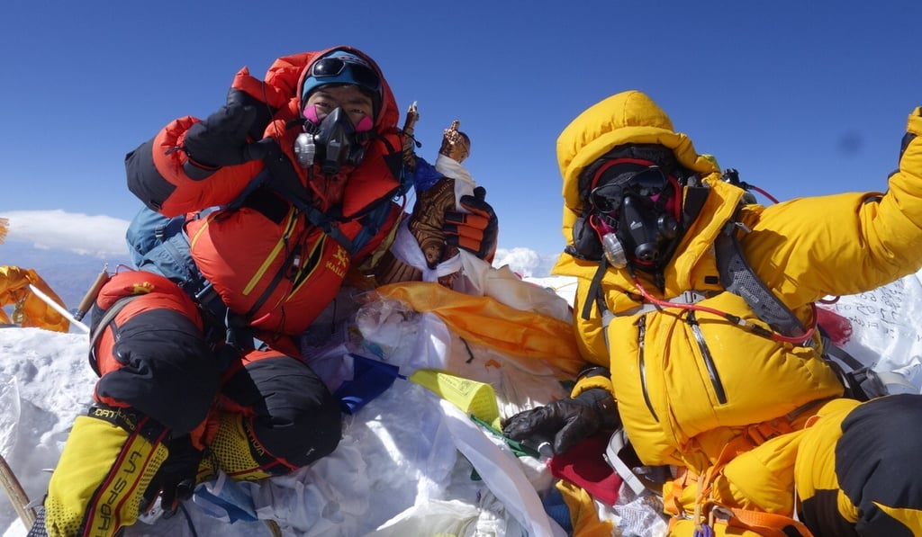 Hongkonger Ada Tsang (in yellow on the right) taking in a moment on Mount Everest. Photo: Handout Hongkonger Ada Tsang (in yellow on the right) taking in a moment on Mount Everest. Photo: Handout