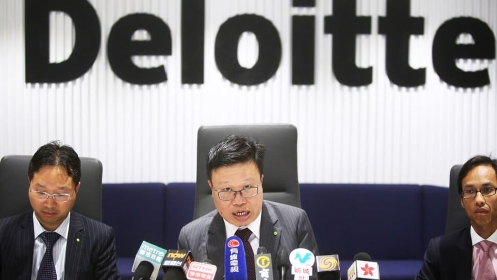 Derek Lai Kar-yan (centre), one of the joint liquidators of Founder Information. Photo: Sam Tsang