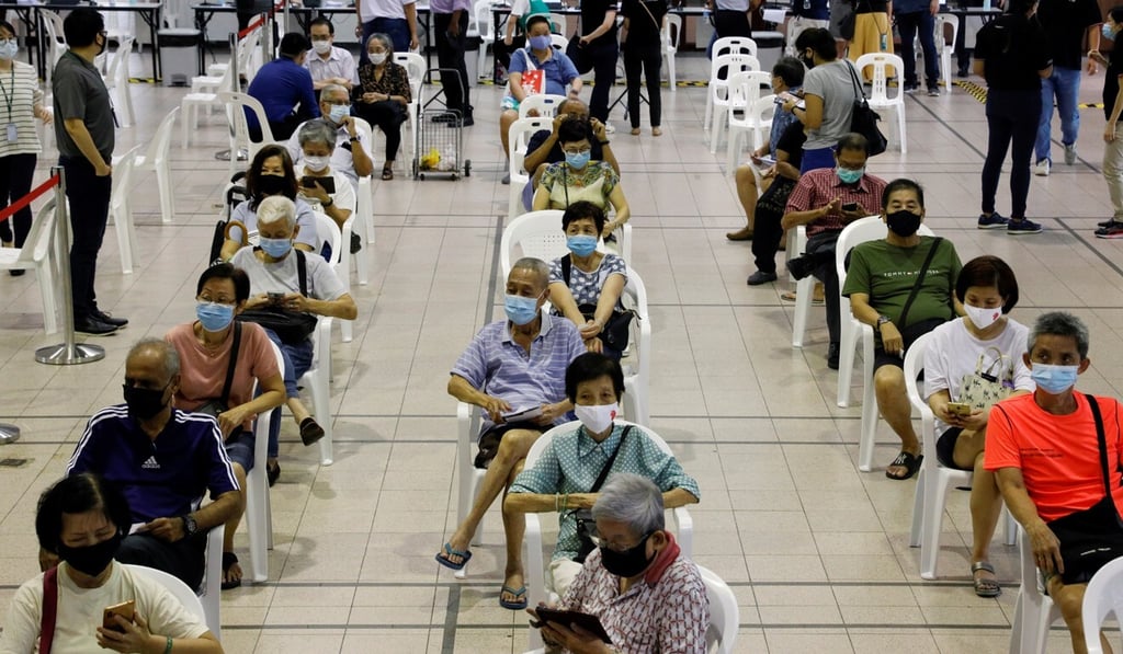 People aged 70 or older wait in an observation area after receiving a dose of Covid-19 vaccine in Singapore in January. Photo: Reuters