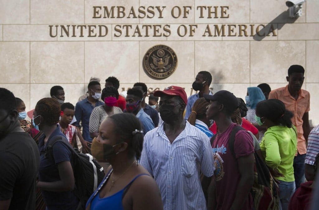 Haitians gather outside the US Embassy in Port-au-Prince to call for visas amid the security fears after President Jovenel Moise’s assassination. Photo: AP Haitians gather outside the US Embassy in Port-au-Prince to call for visas amid the security fears after President Jovenel Moise’s assassination. Photo: AP