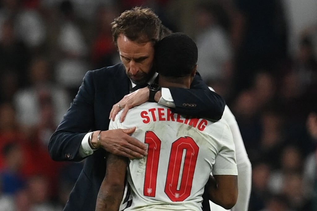 England’s coach Gareth Southgate embraces forward Raheem Sterling after the Uefa Euro 2020 final at Wembley Stadium in London on Sunday. Photo: AFP