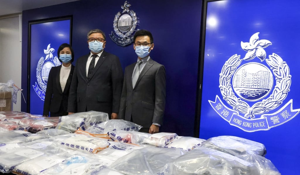 Narcotics bureau Chief Inspector Ip Sau-lan (left) and colleagues display the drugs seized. Photo: K. Y. Cheng