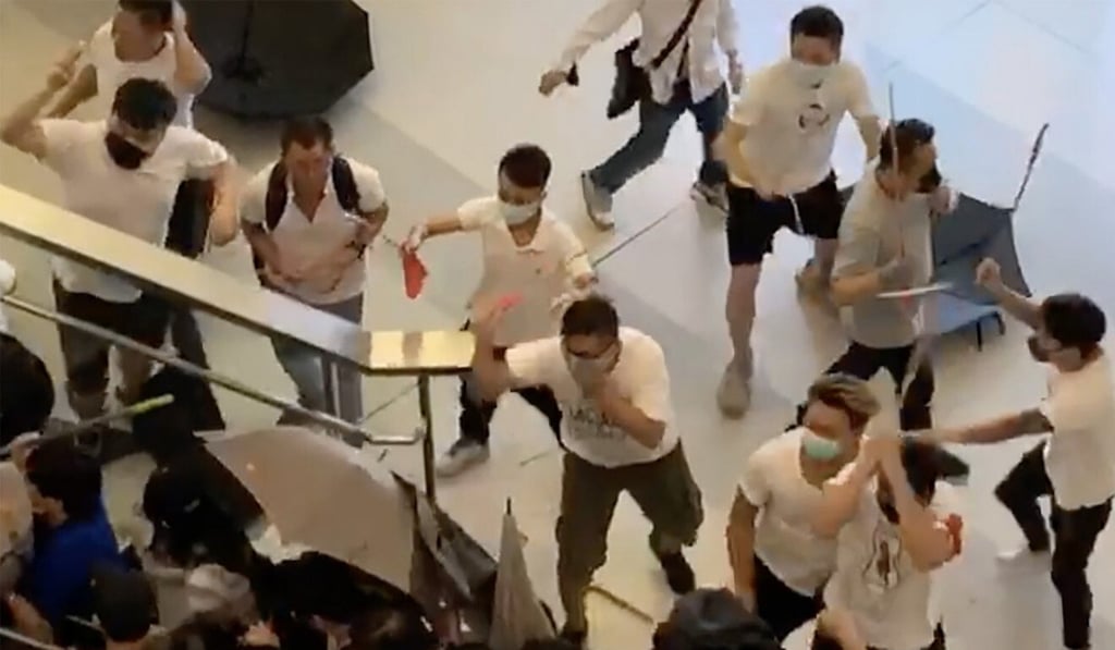 Protesters and passengers were attacked with rattans and wooden sticks. Photo: SCMP Pictures