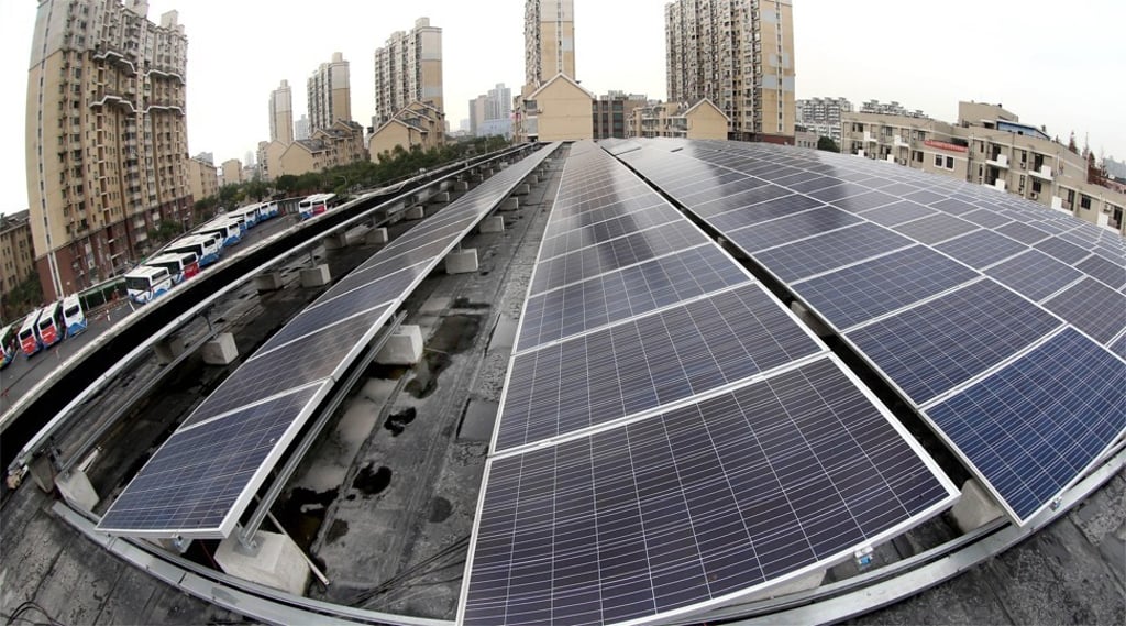 The pilot programme aims to have solar panels installed on rooftops throughout the community. Photo: Xinhua The pilot programme aims to have solar panels installed on rooftops throughout the community. Photo: Xinhua