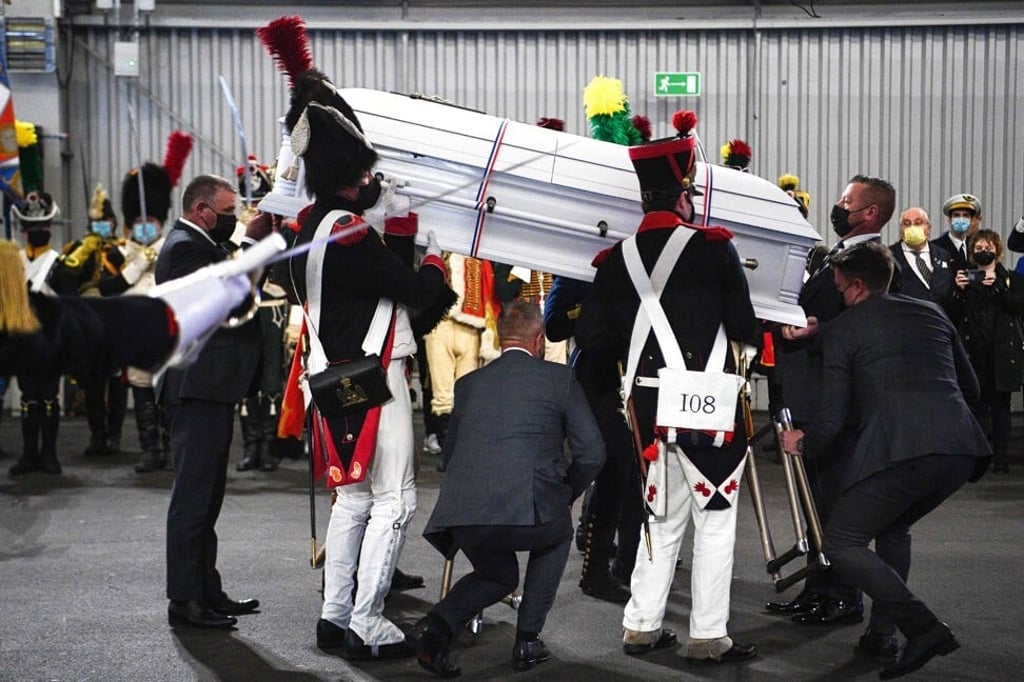 Men dressed as Napoleon-era fighters carry a coffin containing the remains of late French General Charles Etienne Gudin at Le Bourget airport north of Paris on Tuesday. Photo: AFP