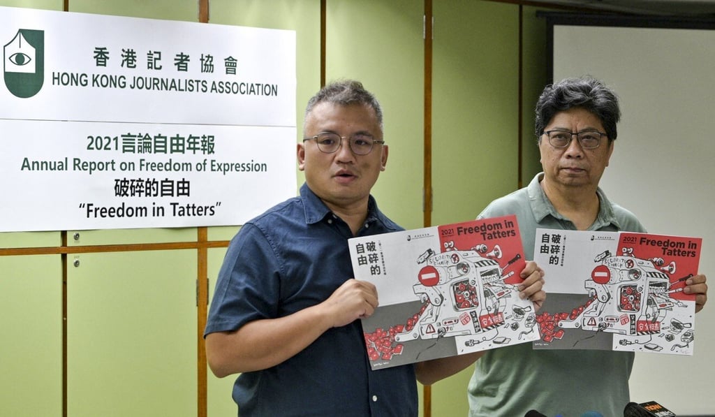 Chairman of the Hong Kong Journalists Association Ronson Chan (left), and Chris Yeung, chief editor of the annual report. Photo: AFP