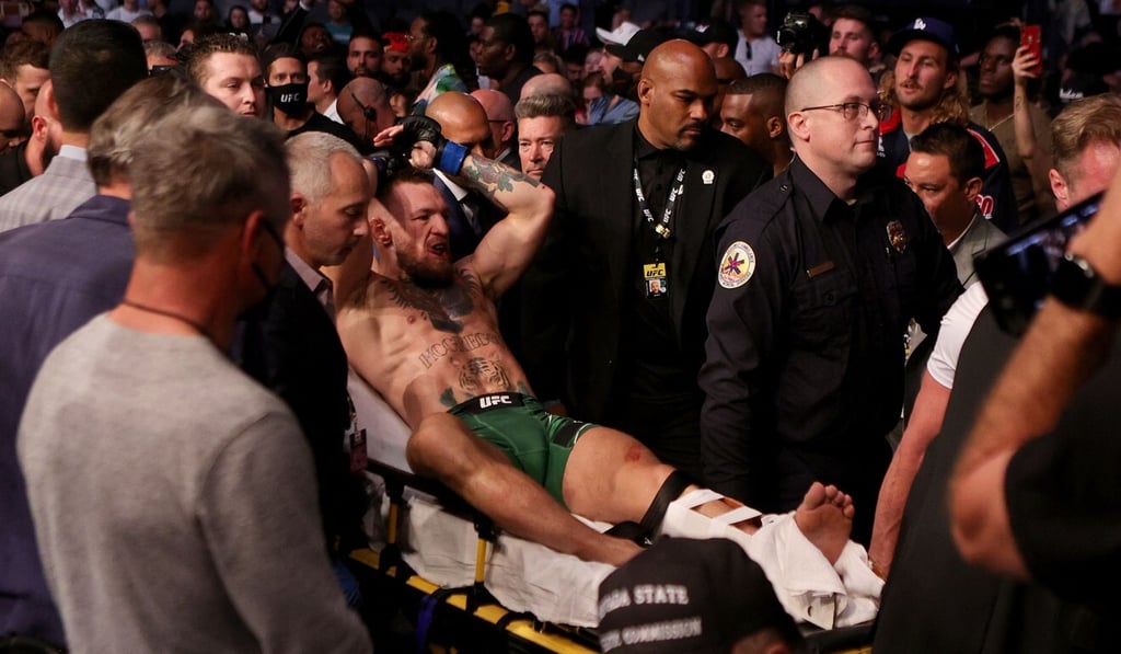 Conor McGregor is stretchered off after his loss to Dustin Poirier. Photo: AFP