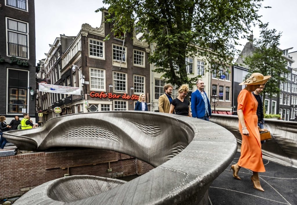 Dutch Queen Maxima, right, opens a 3D-printed bridge on the Oudezijds Achterburgwal in Amsterdam on Thursday. Photo: EPA-EFE
