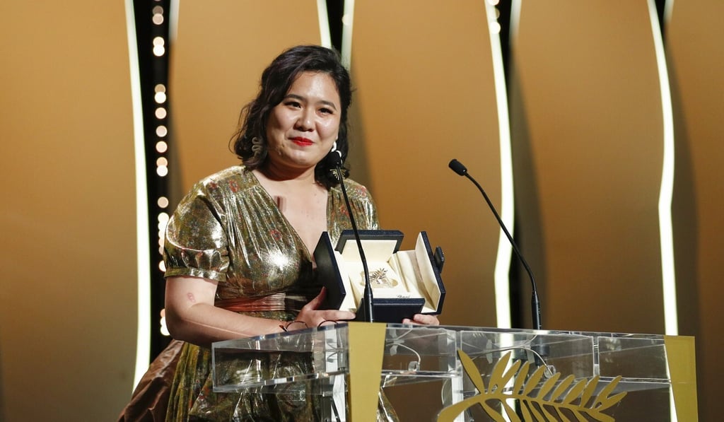 Tang Yi collects her prize for All the Crows in the World. Photo: Reuters Tang Yi collects her prize for All the Crows in the World. Photo: Reuters