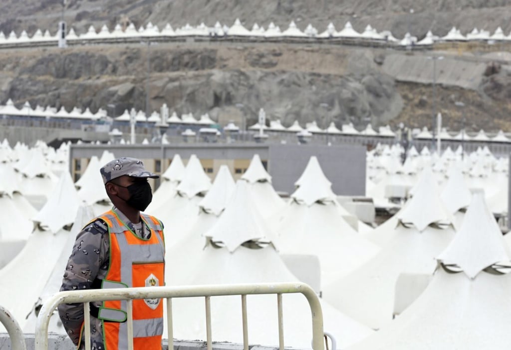 A Saudi soldier stands guard outside a tent camp in Mina, near the Muslim holy city of Mecca, Saudi Arabia on Sunday. Photo: AP A Saudi soldier stands guard outside a tent camp in Mina, near the Muslim holy city of Mecca, Saudi Arabia on Sunday. Photo: AP