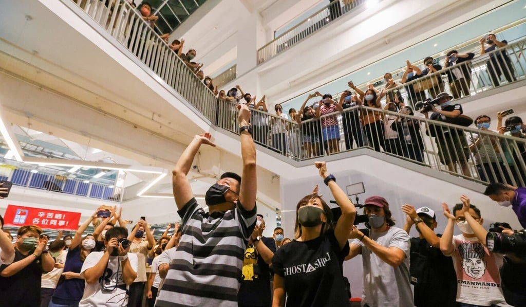 Former Apple Daily executive editor-in-chief Lam Man-chung (centre), seen cheering with staff on the night of the newspaper’s final edition, was denied bail on Thursday. Photo: Dickson Lee