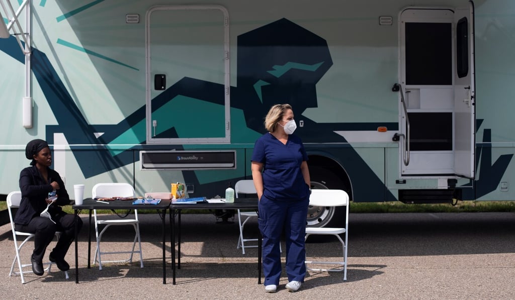 Nurses wait for people wanting a Covid-19 jab at a mobile pop-up vaccination clinic in Detroit on Wednesday. Photo: Reuters