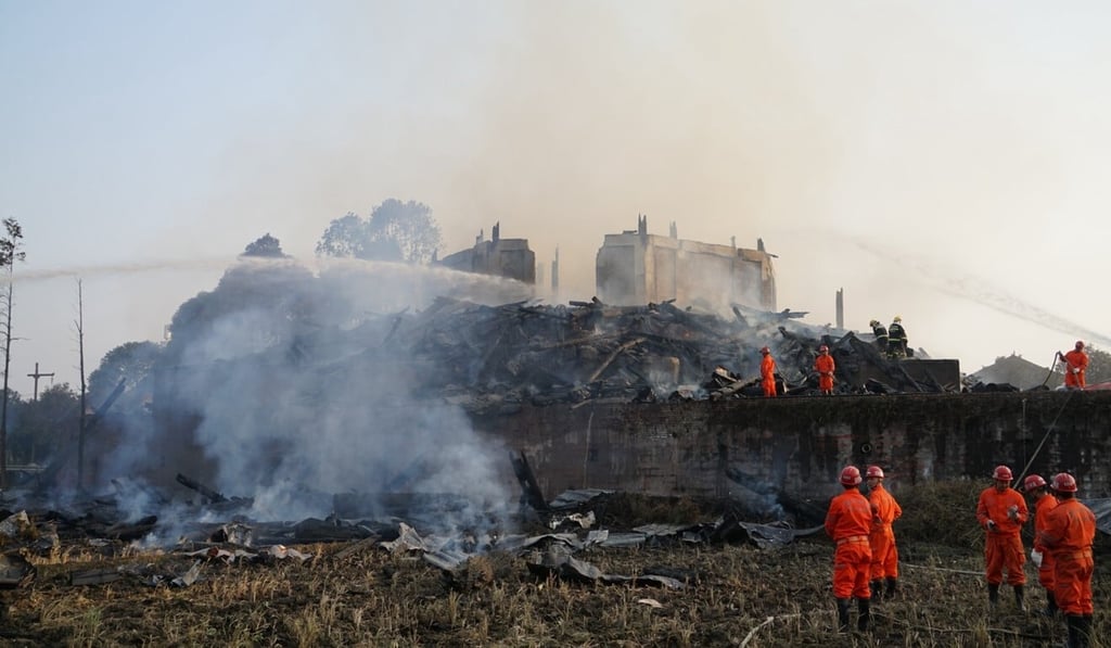 Firefighters put out a blaze that destroyed the Jiulong temple in 2017 in Sichuan, China. Photo: Getty Images