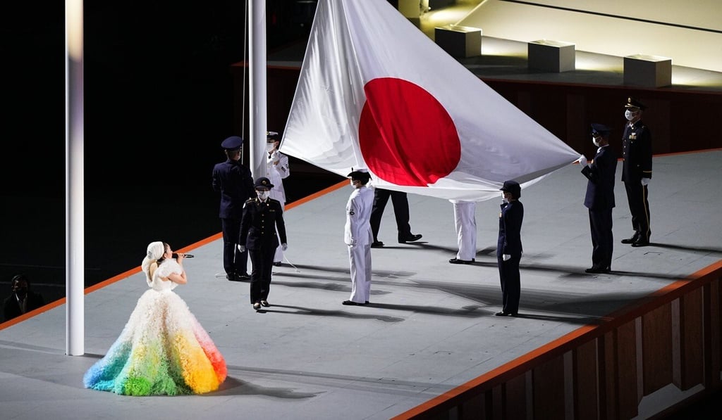 The Japanese national flag is raised during the opening ceremony at Olympic Stadium in Tokyo. Photo: Xinhua