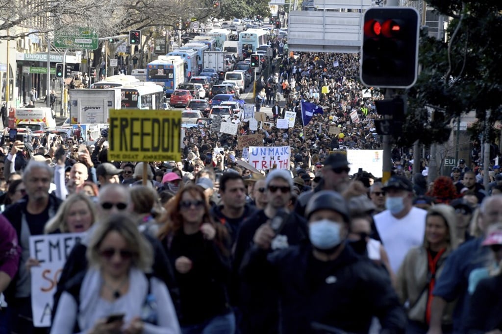 Protesters march through the streets during an anti-lockdown rally in Sydney on July 24, 2021. Photo: AAP Image via AP