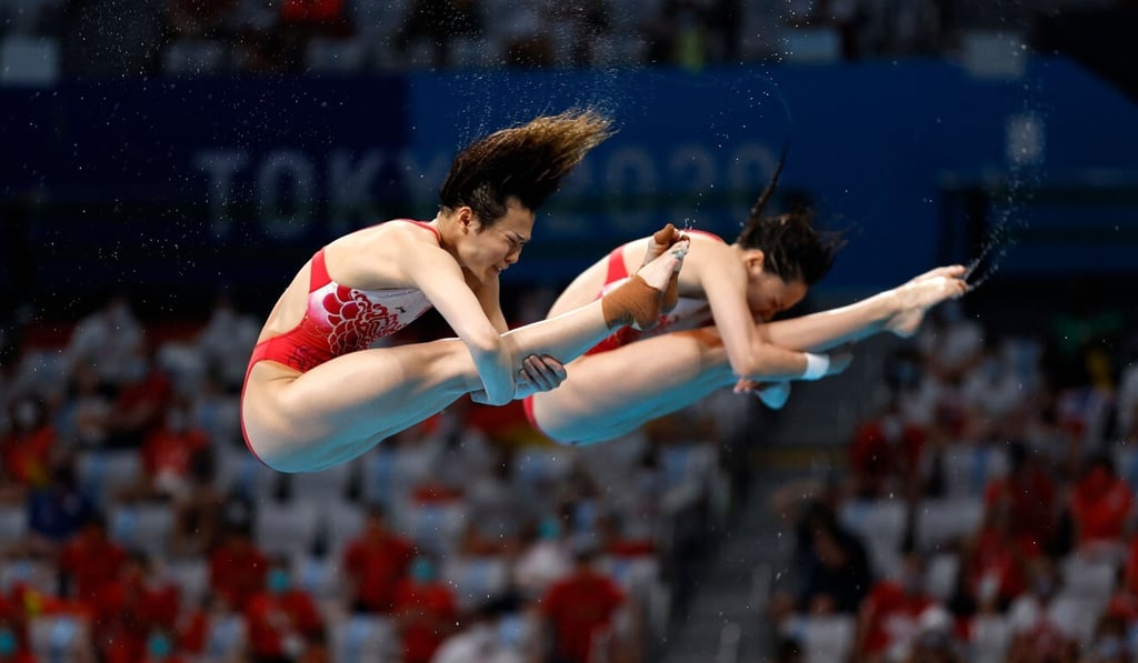 China’s Shi Tingmao and Wang Han set the scene in the diving pool, winning the women's synchronised 3m springboard. Photo: AFP