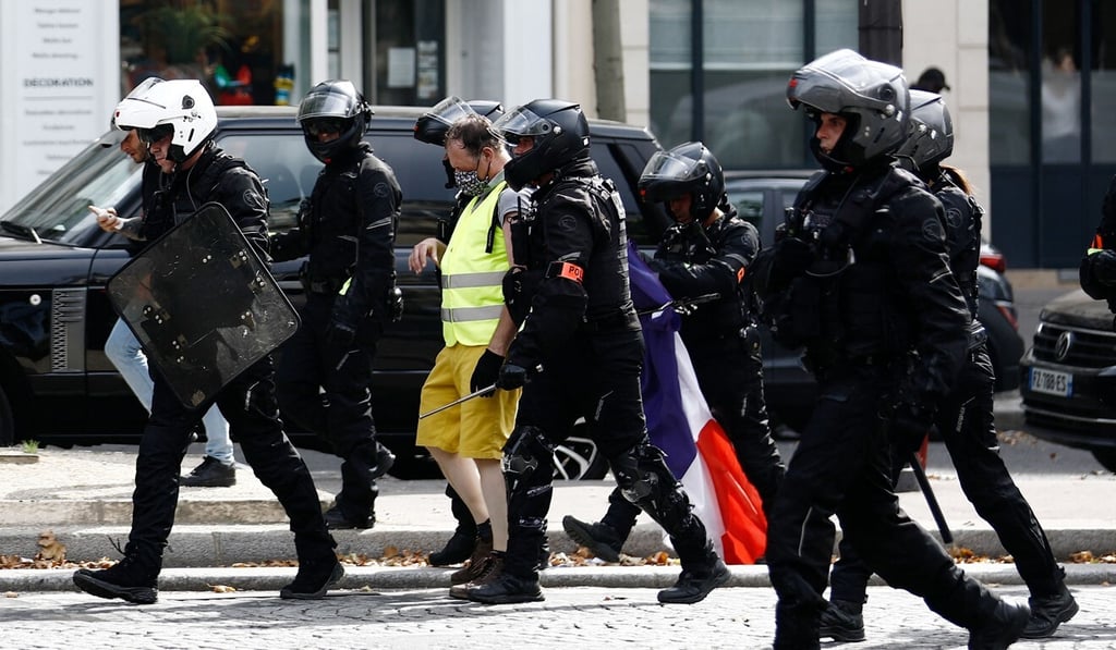 A protester is arrested during clashes in Paris. Photo: AFP A protester is arrested during clashes in Paris. Photo: AFP