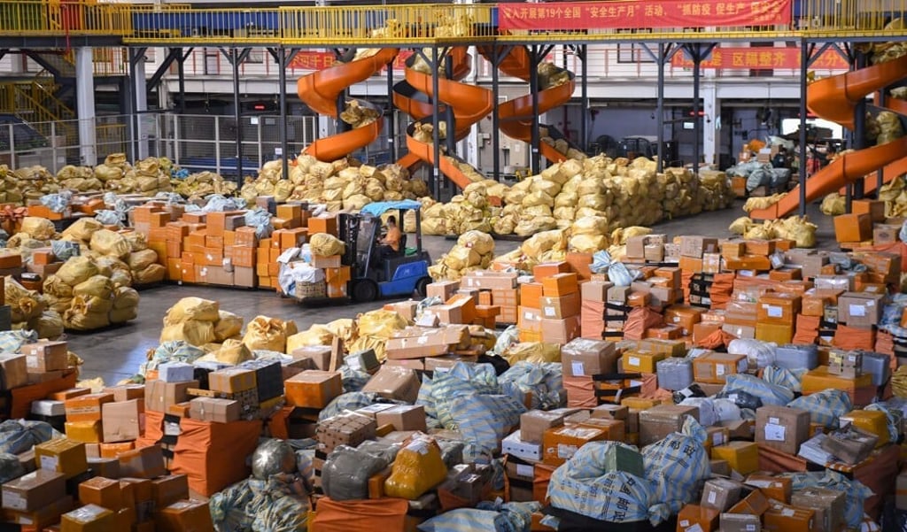 Employees work at an airmail sorting and distribution centre of China Post in Guangzhou. Photo: Xinhua Employees work at an airmail sorting and distribution centre of China Post in Guangzhou. Photo: Xinhua