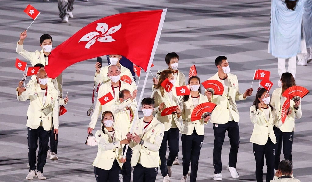 Hong Kong flag bearers Edgar Cheung Ka-long (centre) with Tse Ying-suet at the Tokyo 2020 Olympics opening ceremony. Photo: Reuters