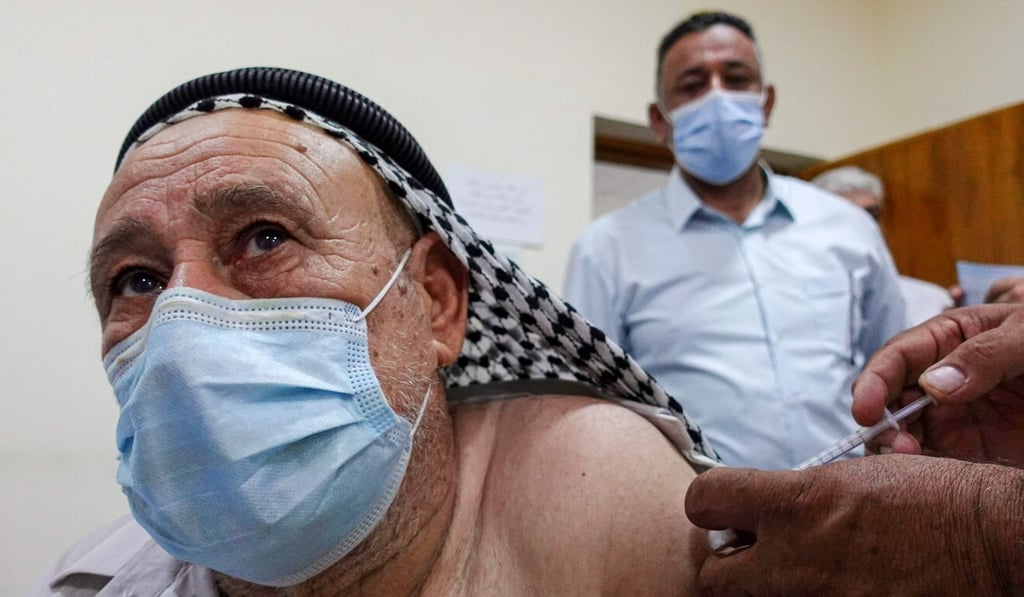 An Iraqi man is inoculated against Covid-19 at a vaccination centre in the city of Kufa on Sunday. Photo: AFP