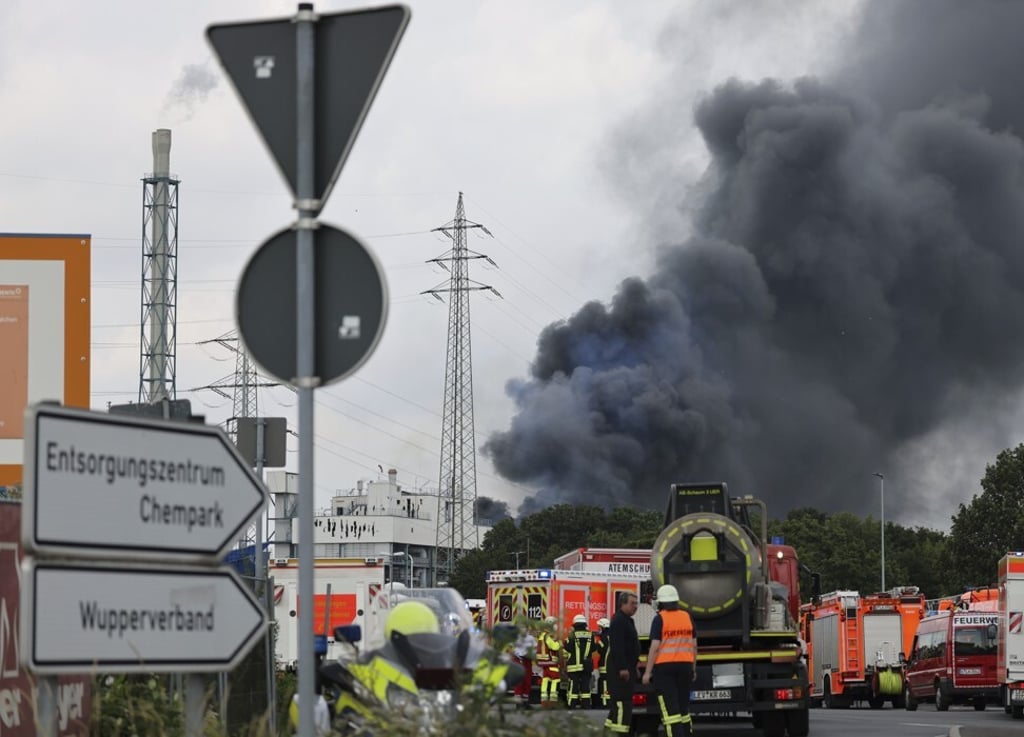A dark cloud of smoke rises above the Chempark in Leverkusen, Germany, on Tuesday. Photo: DPA via AP